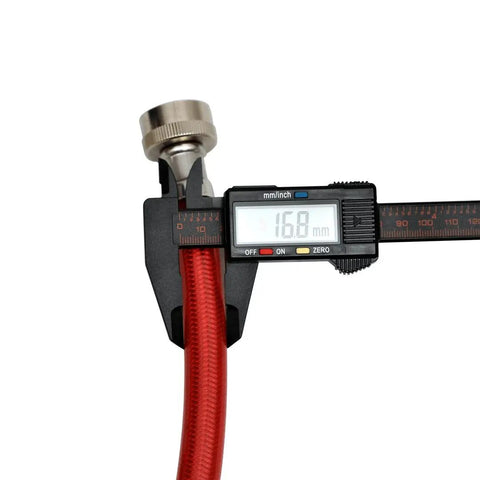 Close-up of red color-coded 4ft burst-proof washer hose with diameter measurement, part of 2-pack stainless steel universal fit set.