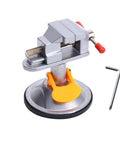 Compact Handy Bench Vise Clamp With Suction Base 360 Degree Swivel For Jewelry Making Watch Repair Soldering Model Building And Small Parts Hobby Projects 98mm Silver, shown with adjustable jaws and Allen key.