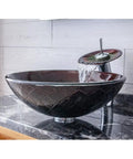 Top Shelf Tempered Glass Vessel Sink Built Tough As Nails With Slick Waterfall Faucet Flow For No Sweat Bathroom Vanity Setup And Easy Daily Washing That Looks Absolutely Straight Fire, brown glass basin on marble countertop.