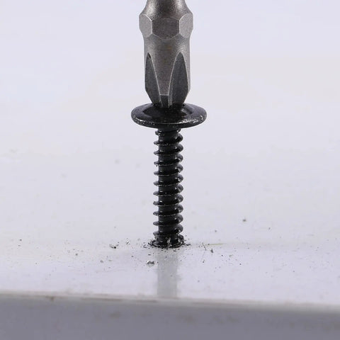 Top Tier Number 8 By Half Inch Sheet Metal Screws With Truss Heads 100 Pack Of 410 Stainless Steel Fast Self Tapping Bolts In Black Oxide Finish close-up of a black oxide truss head screw driven into a surface.
