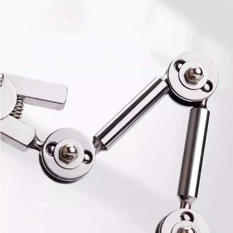 Close-up of Universal Welding Fixture With Clamp Rebound Jig and Third Hand Soldering Station joints, metal components visible.