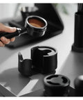 Heavy Duty Adjustable 51 53 58 Millimeter Portafilter Holder Tamping Platform crafted from tough aluminum with portafilter.