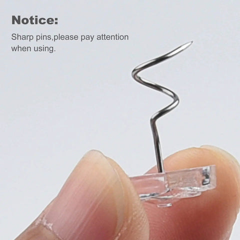 Close-up of a stainless steel twist pin with clear rose head for Fifty Piece Upholstery Twist Pins Featuring Slick Clear Rose Heads And Compact Storage Box Rock Solid Fabric Fasteners No Hassle Setup Heavy Duty Gear Dang Easy To Use For Bed Skirts And Sofas.