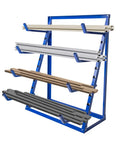 Sturdy Four Tier Shop Storage Rack With Adjustable Steel Bars For Lumber Planks And Piping Rock Solid Workshop Shelving System showcasing lumber and pipes on steel rails.
