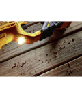 Close-up of the 20 Volt Brushless Compact Cordless Drill With Half Inch Chuck focused on the LED light illuminating wood.