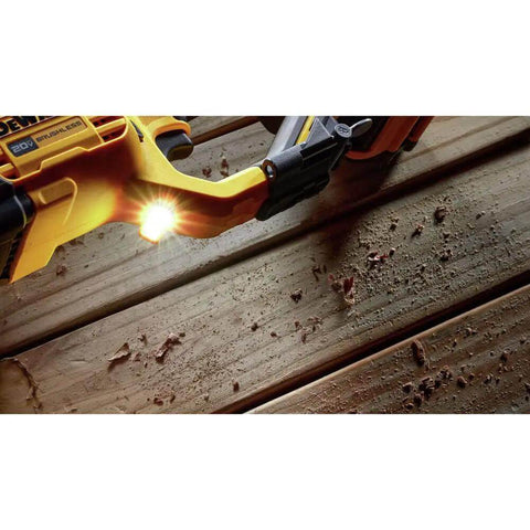 Close-up of the 20 Volt Brushless Compact Cordless Drill With Half Inch Chuck focused on the LED light illuminating wood.