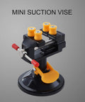 Mini Suction Vise Clamp With 360 Degree Swivel Head grabs tight on smooth desks, featuring a sturdy black aluminum body.