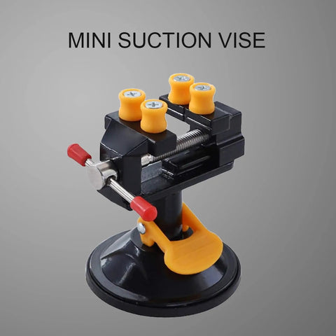 Mini Suction Vise Clamp With 360 Degree Swivel Head grabs tight on smooth desks, featuring a sturdy black aluminum body.