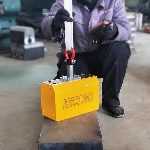 Zero Fuss Heavy Duty Automatic Magnetic Lifter 2200 Lbs Capacity shown lifting steel plate in an industrial setup.