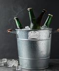 Galvanized bucket with 2 Pack Heavy Duty Chest Handles Zinc Plated Case Pull Handles, holding beer bottles and ice cubes.