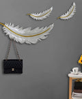 Knockout Modern Wall Mounted Coat Hooks For Tight Spaces With Seven Rust Proof Resin Hangers providing stylish storage for a handbag.