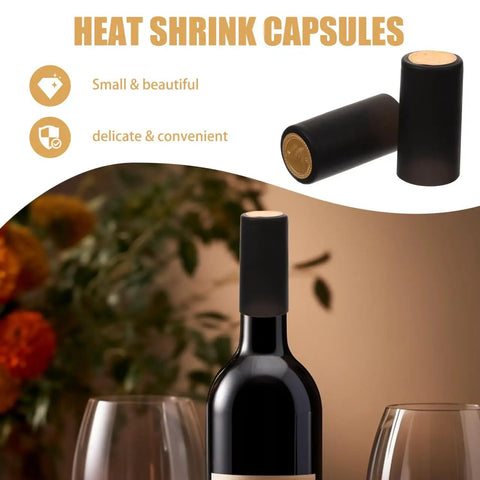 Wine Heat Shrink Capsules Set 100 Pieces With PVC Bottle Sealing Film Disposable Shrink Wrap Caps In Black For Freshness And Oxygen Lock Easy Seal Pro Grade on a wine bottle and one rolled next to glasses.