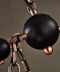 Close-up of Industrial Vintage Wooden Pendant Light With Glass Lanterns chain and fixture details in black and bronze finish.