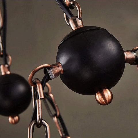 Close-up of Industrial Vintage Wooden Pendant Light With Glass Lanterns chain and fixture details in black and bronze finish.