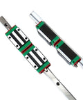 Top Shelf Linear Motion Guide Slider And Rail Set Packing Four Reliable Hgh25Ca Slides And Two Heavy Duty Hgr25 Rails on a silver track.