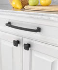 10 Pack 7 Inch Matte Black Cabinet Handles With 177mm Hole Centers, installed on white kitchen drawers.