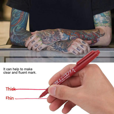 Smooth Double Ended Markers For Piercing And Art Projects, 10 Piece Set shown on tattooed hands using red ink pen.