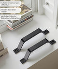 6.1 Inch Matte Black Sliding Barn Door Handle Pull 2 Pack Heavy Duty Zinc Alloy For Cabinet Drawer Dresser Closet No Drill Install Easy Mount Rustproof displayed on a white surface near books