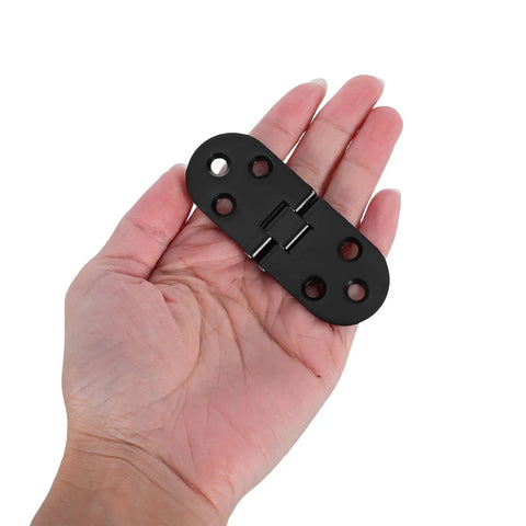 8 Piece Black Zinc Alloy Folding Table Flip Top Hinges With 180 Degree Round Edge Design held in hand, showing size and design.