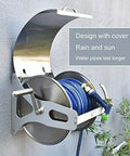 Heavy Duty Stainless Steel Garden Hose Reel With Secure Lid And Smooth Crank Rewind wall mounted with blue hose visible