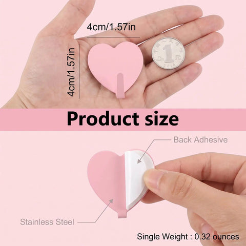 Super Sweet Pink Heart Wall Hooks 10 Pack Adhesive Hangars For Heavy Keys Towels Jackets And Bags Freakin Cute Decorative Storage Organizer For Bathroom Bedroom Or Entryway That Totally Slays Everyday Life displayed in hand showing size and adhesive backing features.