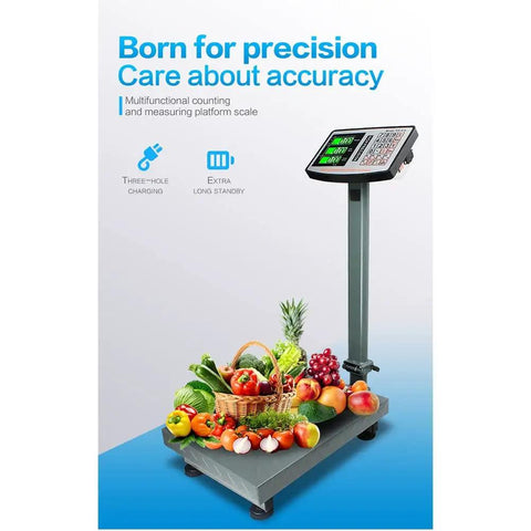 Heavy Duty Digital Platform Scale With Bright HD LCD Screen Straight Up Precision For Luggage Package Weight Tracking And Postal Shipping on a gray surface with fruits and vegetables.