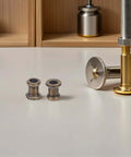 Grab These 8pcs Long Thread Lamp Pipe Couplers Made Of Heavy Duty Zinc To Join Light Fixture Connectors And Extend Pendant Rods With Ease For Any Home Glow Project, two zinc couplers on table
