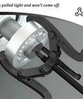 Heavy Duty Carbon Steel Three Jaw Reversible Gear And Bearing Puller extract bolt tightly on a bearing, showcasing its secure grip.