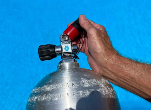 Hand securing ergonomic scuba tank valve cap set two pack with pull tab, textured grip, no slip for wet fingers, fits most valves.