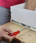 Installing 14 Inch Keyboard Drawer Slide Rails with ball bearings under a desk for smooth operation, showcasing the mounting process.