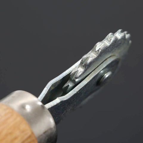 Close-up of Spur Wire Embedder Tool for Beehives, showing metal wire wheel for easy frame wiring and smooth comb installation.