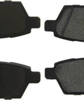 Centric C-Tek ceramic rear brake pad set for Nissan; four pads shown with dark backing and friction material.