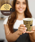 Woman holding 8 Ounce Disposable Paper Coffee Cup For Hot Beverages To Go Leak Resistant And Sturdy, ideal for cafes and home.
