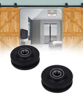 2 Pack Barn Door Sliding Roller Wheels Kit For DIY Sliding Door Project in front of wooden barn doors on track