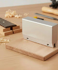 Pro Grade Guitar Fret Press Jig Caul Tool For Luthiers Rugged Aluminum Housing Reusable Fixture For Precise Fret Installation Easy Wrench Adjustments Ideal For Repair Training DIY Makers And Shops, shown on wood board