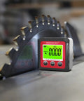 Straight Up Digital Angle Finder With Heavy Duty Magnetic V Groove Base And Bright Backlight For Fast Table Saw Cuts positioned near a saw blade.