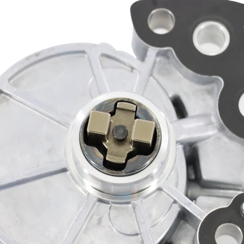 Close-up of brake vacuum pump rotor assembly with a cross-shaped hub in silver metal.