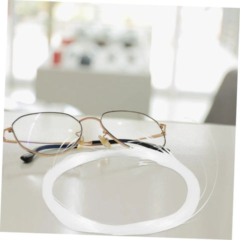 Glasses Repair Thread Kit For Half Frame Eyewear Lanyard And Wire Repair Tool on table with stainless steel thread beside specs
