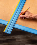 Low Profile Straight Edge Guide Rail Kit Extension Setup For Circular Saw Router And Jigsaw That Snaps Right On And Keeps Your Cuts Dead On Across Plywood And Solid Stock Wood with a hand marking on wood.