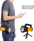 Person wearing Ultra Bright Handheld Spotlight Flashlight With Lantern Mode on strap, orange color next to image on tripod.