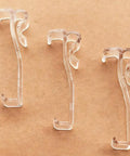 Three clear 2.5 inch Window Blind Valance Clips made of durable plastic, designed for easy snap-on installation.