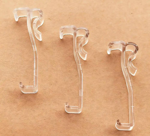 Three clear 2.5 inch Window Blind Valance Clips made of durable plastic, designed for easy snap-on installation.