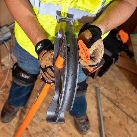 Worker using Iron Conduit Bender Full Assembly For Three Quarter Inch EMT And One Half Inch Rigid With Wide Foot Pedal Angle Setter
