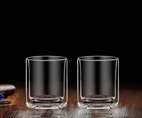 Double Wall Whiskey Rocks Glasses for Your Whiskey and Scotch Favorites 5.5 Oz clear insulated tumblers on wooden surface.