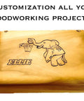 Wooden box engraved with an elephant playing basketball and the name Ellie, showcasing customization in woodworking projects.