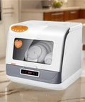 Compact Countertop Dishwasher Featuring Hot Water Sanitizing And Rapid Dry Cycle A Real Game Changer For Tight Kitchens Making Cleanup A Breeze For Busy Folks Who Want That Smooth Experience, in white with dishes inside.