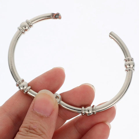 Close-up of 12 Piece Zinc Alloy Shower Curtain Hooks With Smooth Glide Double Sided Rings For Bathroom Rods No Tools Needed Easy Install Durable Rust Resistant With Shiny Silver Finish.