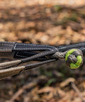 Soft Shackle For Off Road Recovery 30,800 Lbs Breaking Strength connected to tow ropes in a forest setting.