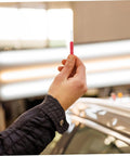 Person holding red 2 Pack Piercing Test Probes For Digital Multimeters And Wire Testers Pro Grade 0.7 mm in auto repair shop.