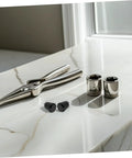 Retractable Spring Locating Pins Set Of 4 With Black Reset Spring on a marble surface with tools and sockets.